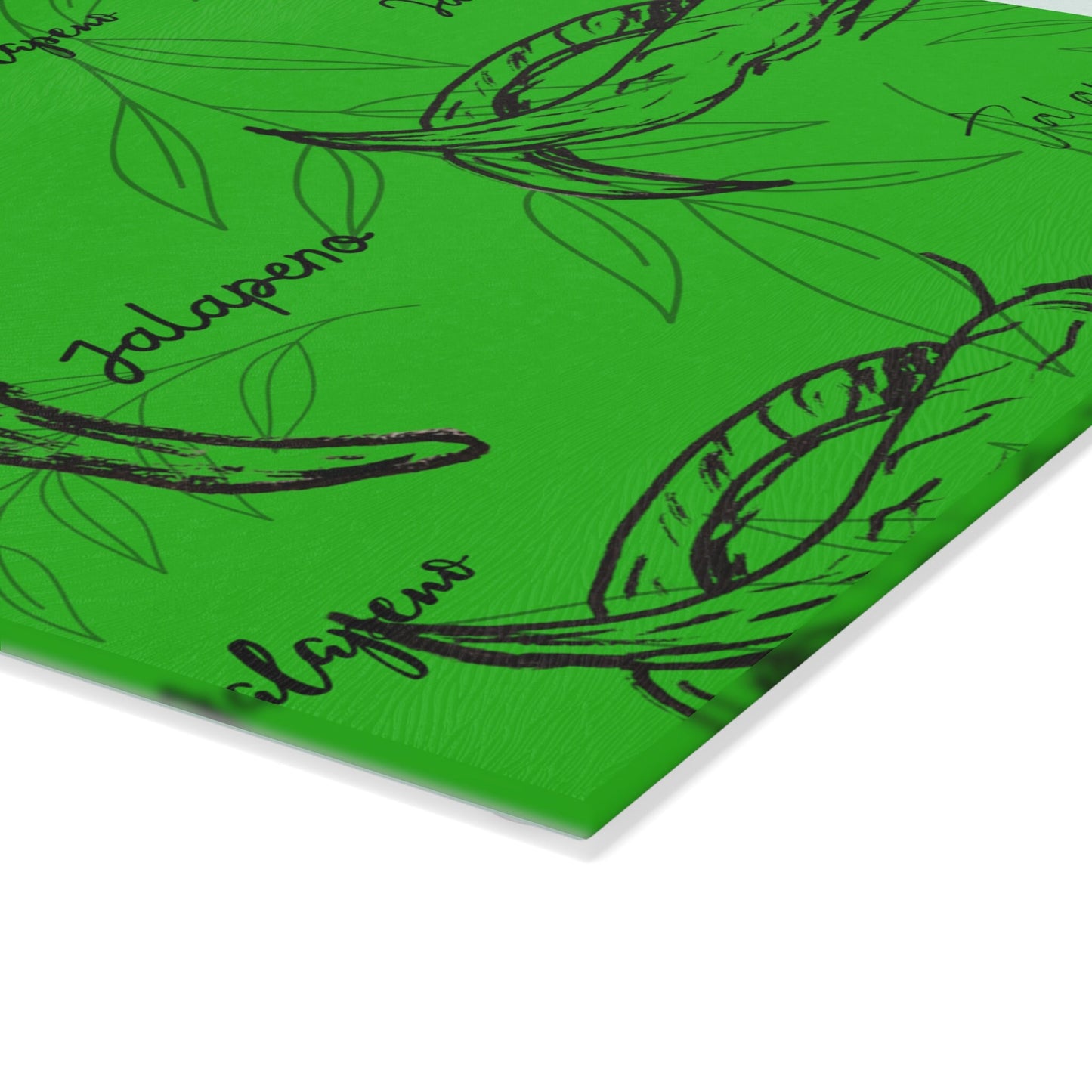 Glass Cutting Board with Original Jalapeno Hand Drawings Over Green Background